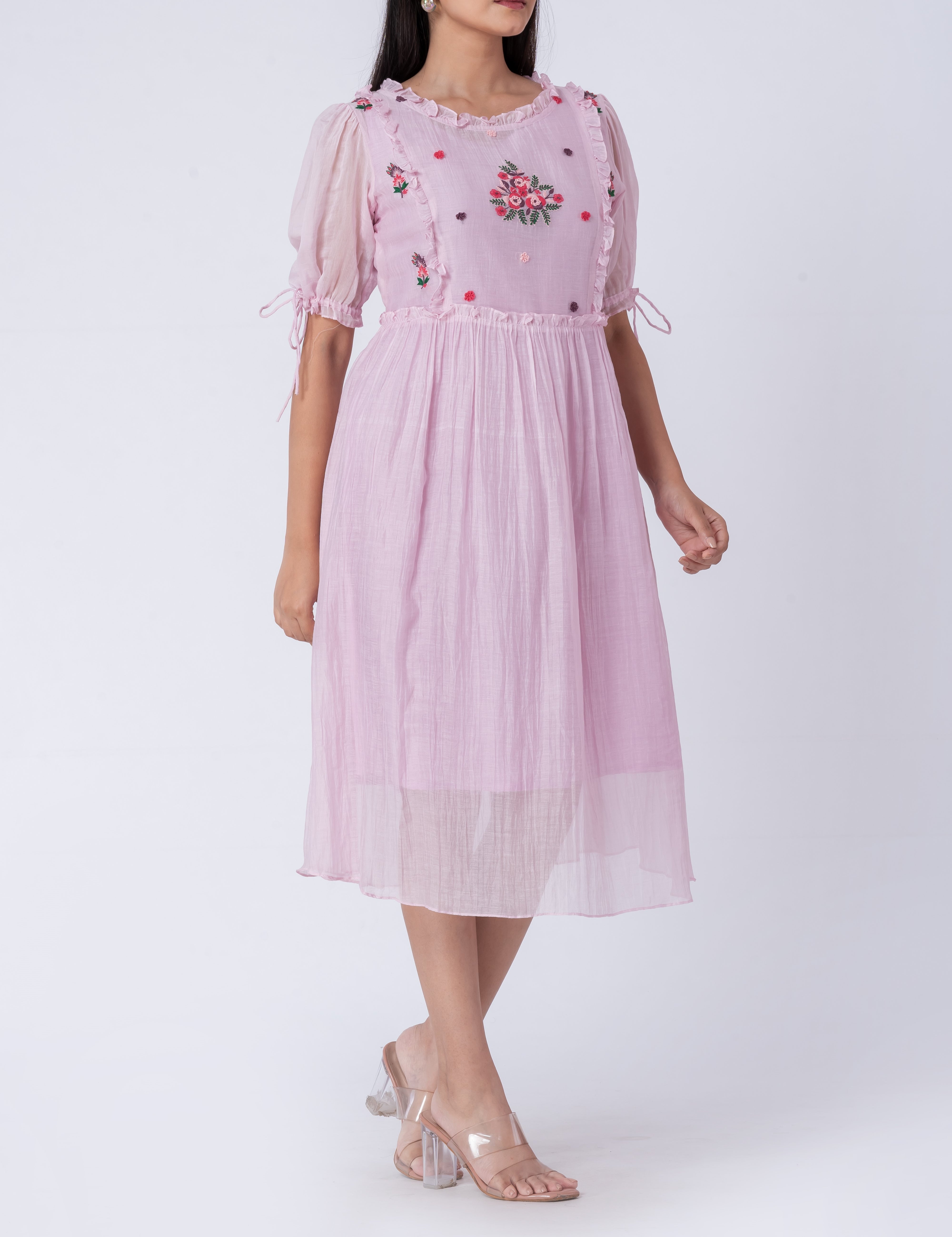  Front view of hand-embroidered floral cotton silk midi dress with puff sleeves.