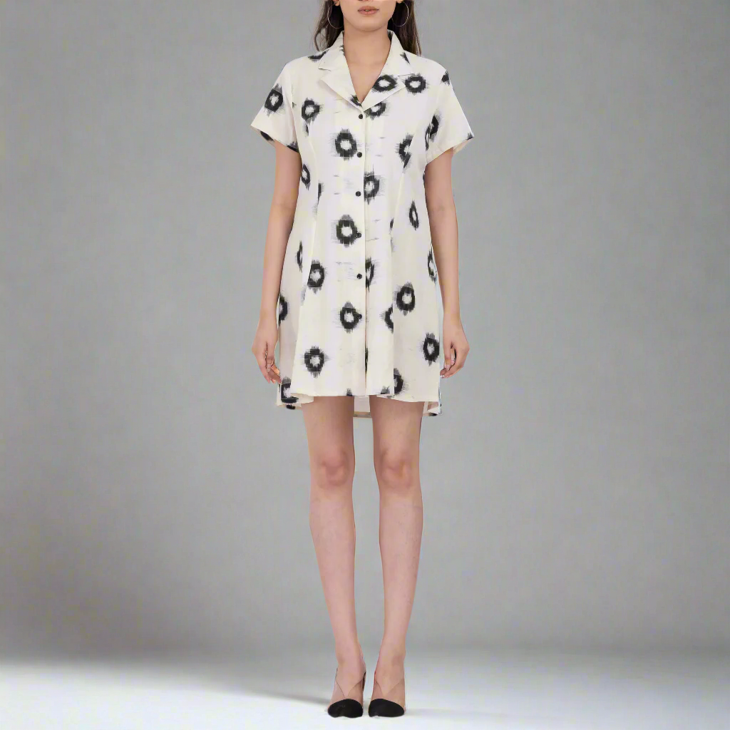 a mini dress made from handloom cotton with a bold abstract black and white print and collared neckline