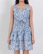 Sleeveless floral dress with a belt accentuating the waist