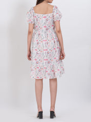 Boho-inspired floral dress with square neck and puff sleeve details