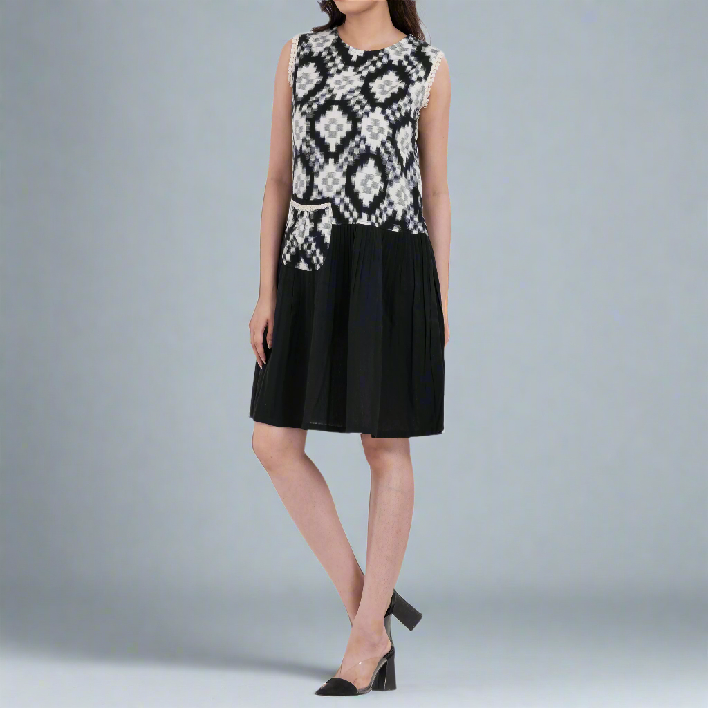 bohemian style ikat print mini dress with airy flared hem and sleeveless cut in soft handloom cotton.