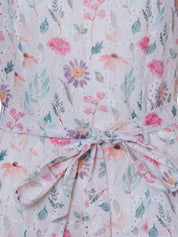 Boho-inspired floral mini dress with adjustable waist tie.