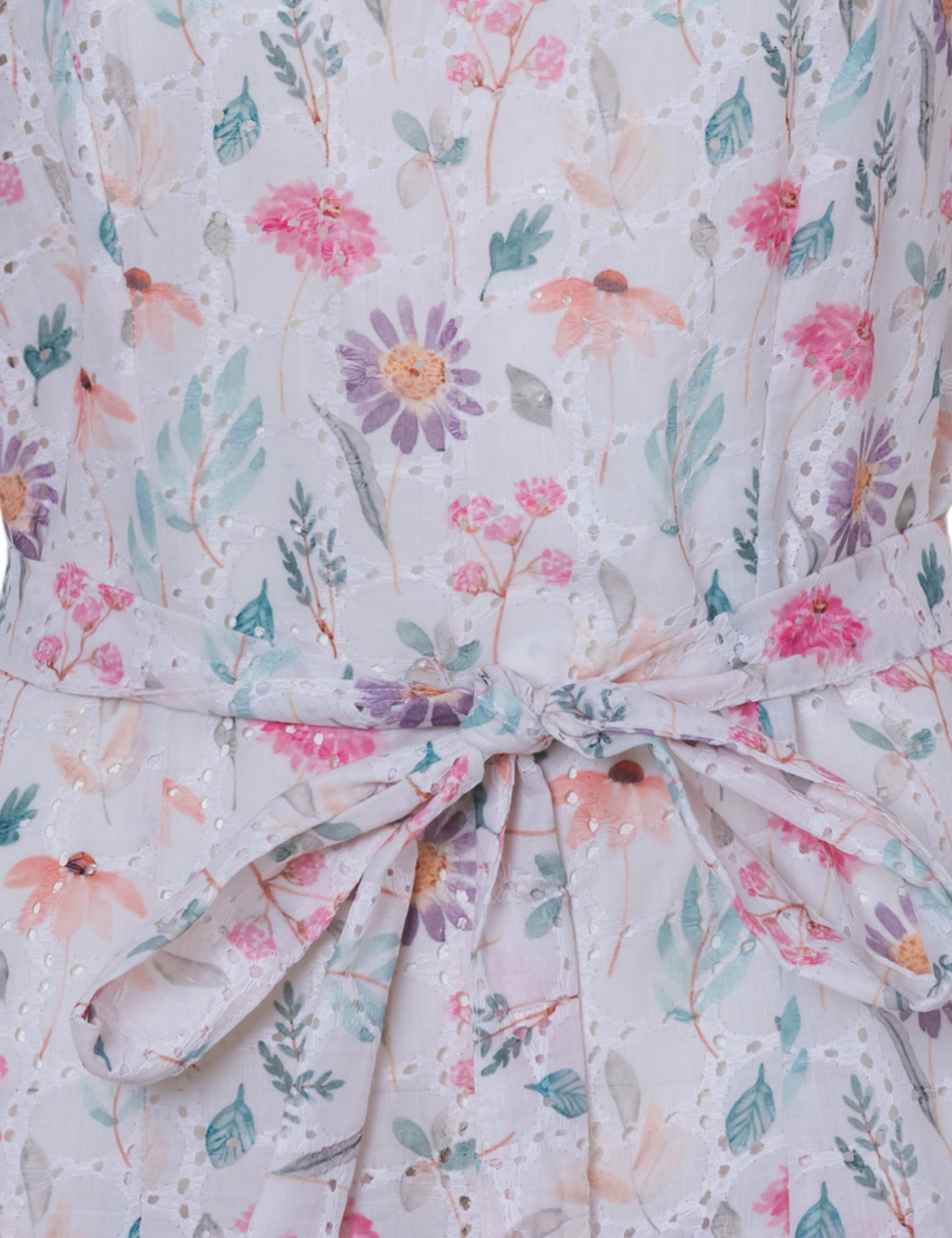 Boho-inspired floral mini dress with adjustable waist tie.