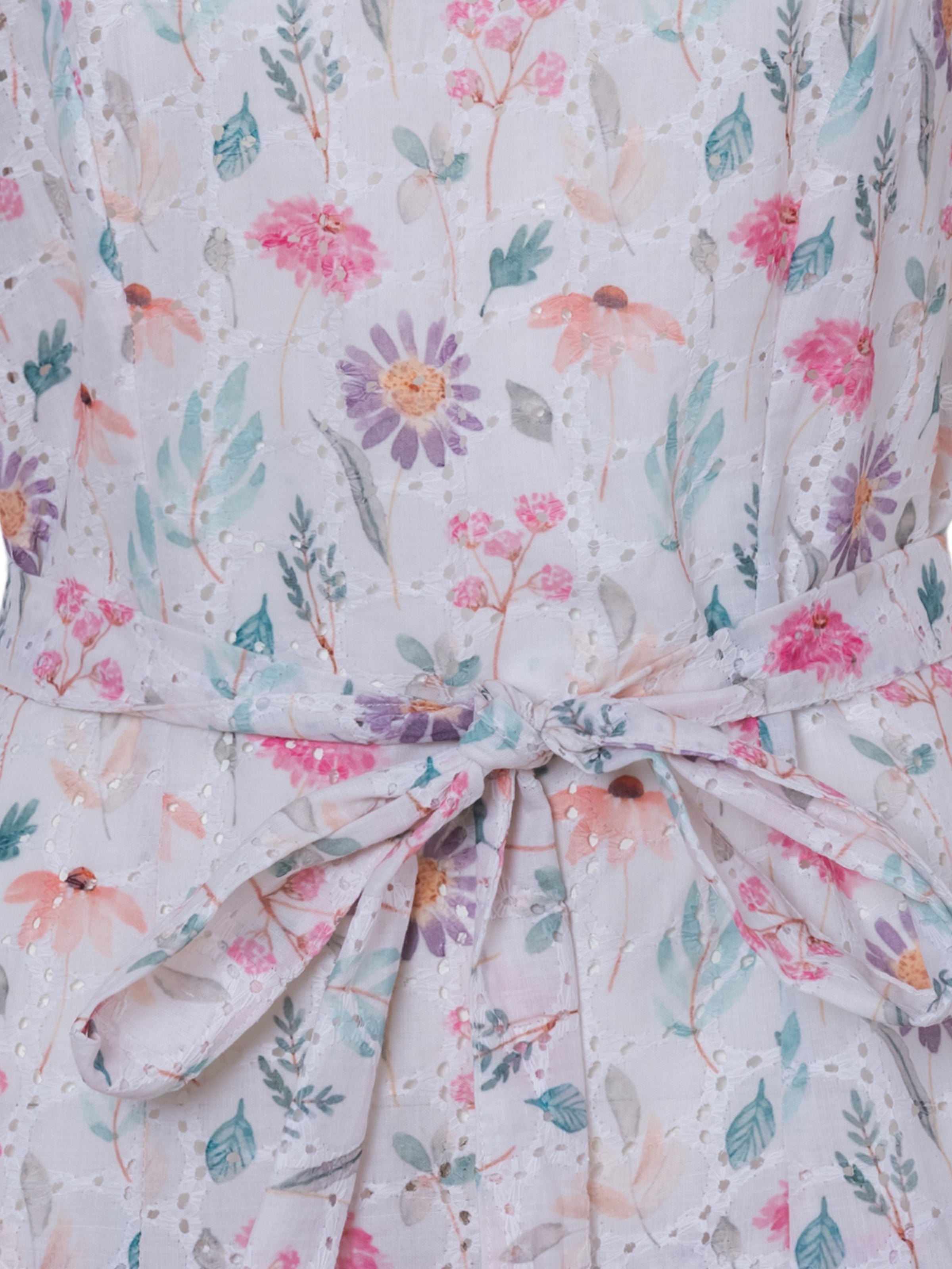 Boho-inspired floral mini dress with adjustable waist tie.