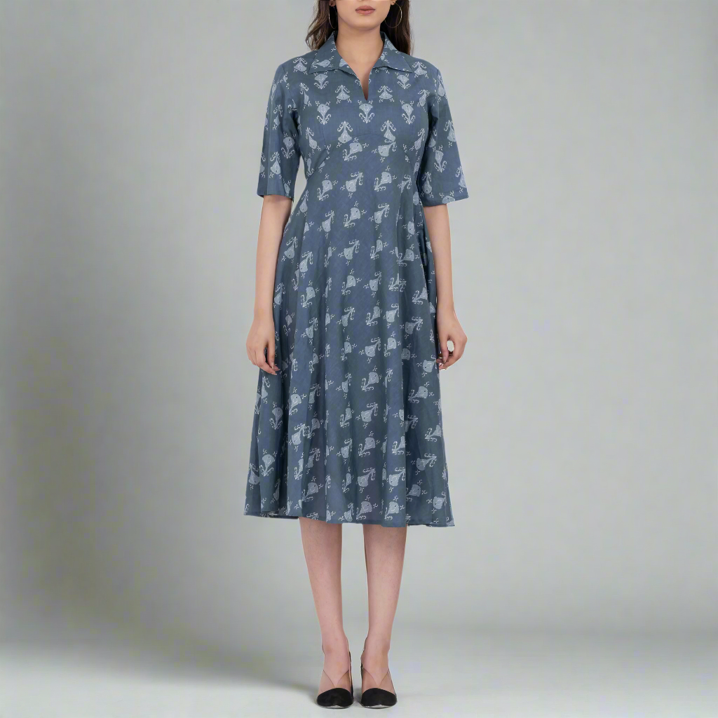 Short sleeve detail of the floral print A-line midi dress, highlighting its lightweight fabric.