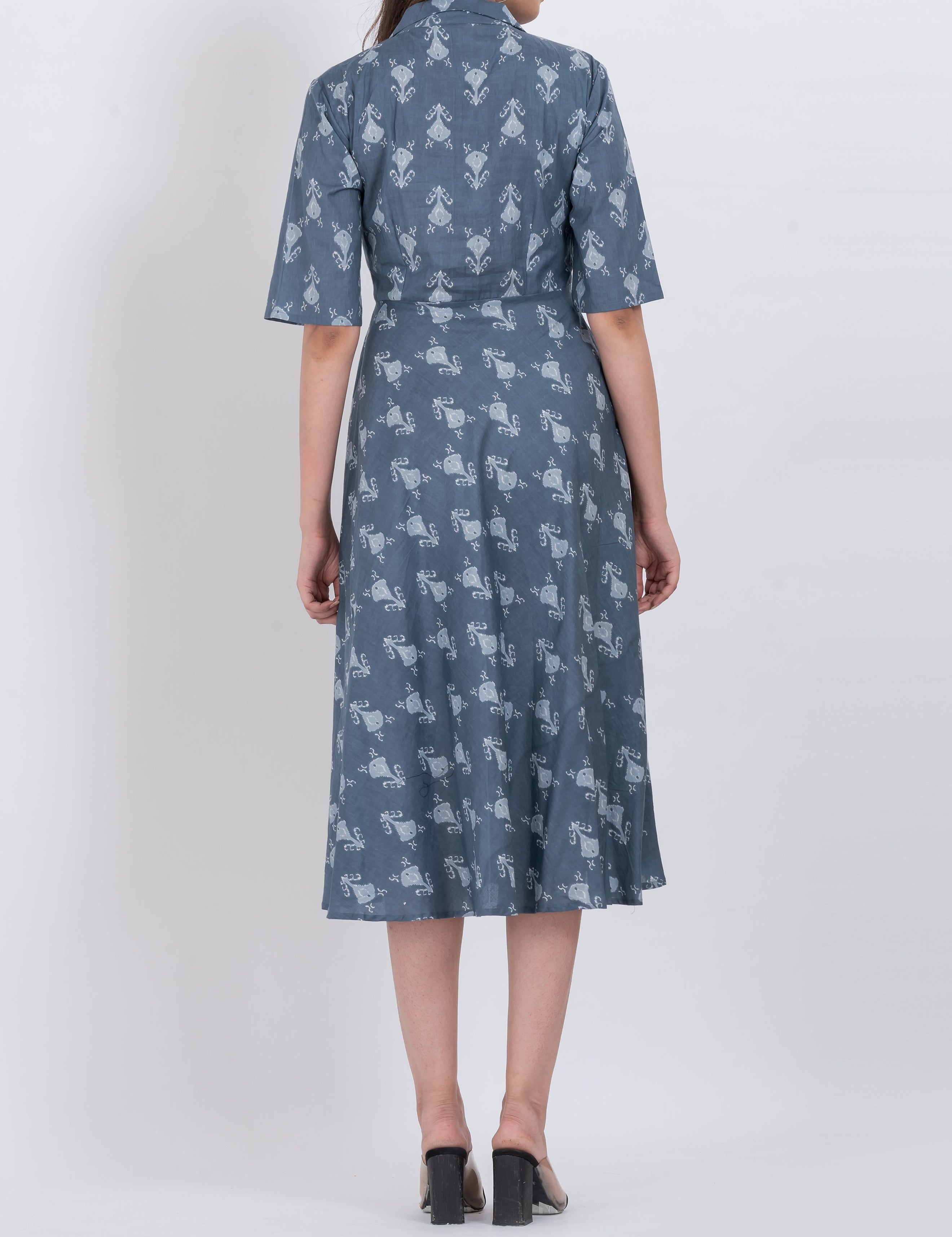 Model wearing a floral collared midi dress with short sleeves and a flattering A-line cut.