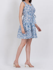  Close-up of waist tie feature in a floral print dress