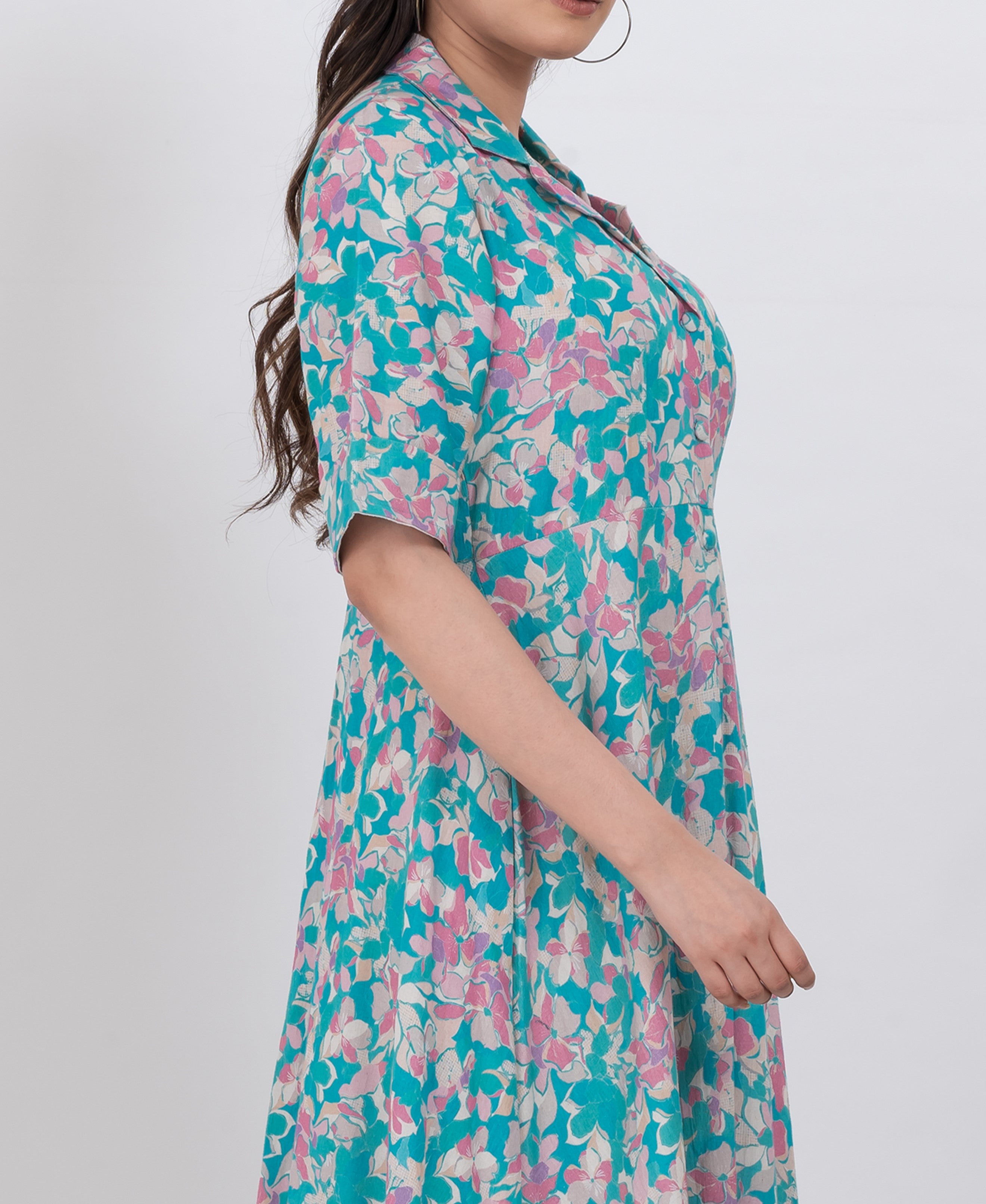  a long flowy floral print maxi dress with a collared neckline and half sleeves for a casual chic look