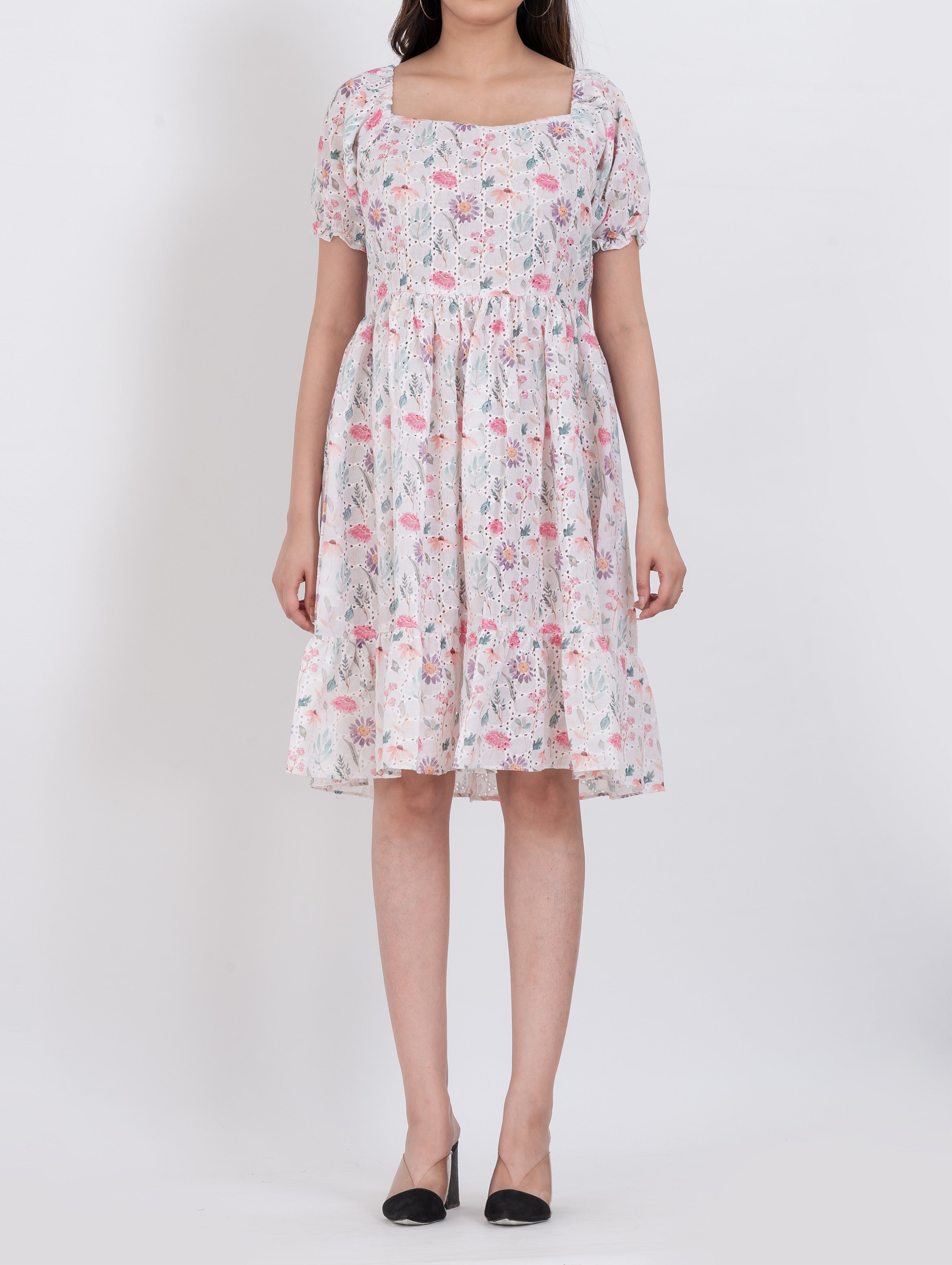 Floral print dress featuring puff sleeves and tiered A-line shape for an effortless look