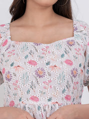 Floral puff sleeve dress with square neckline and tiered A-line silhouette