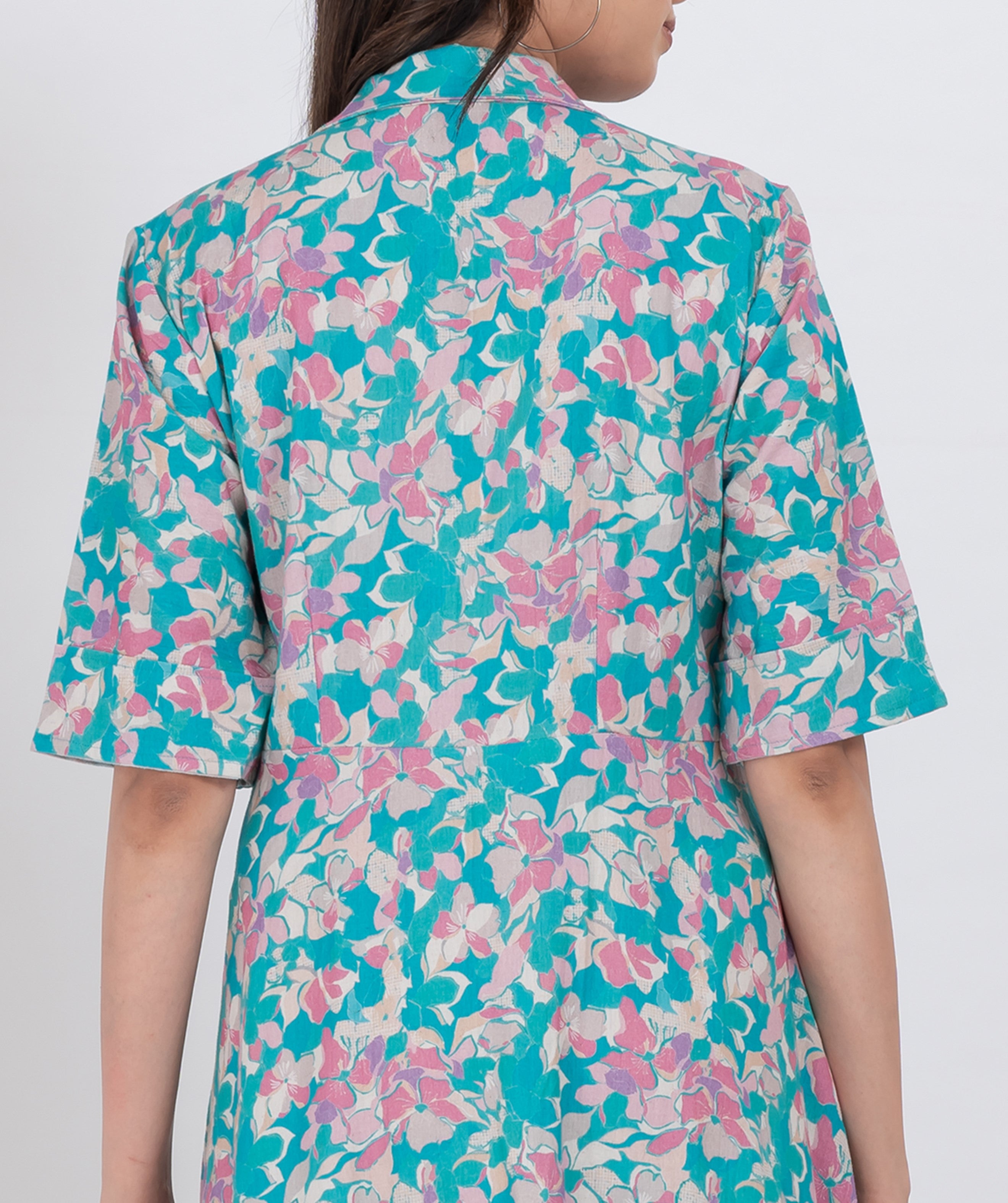 a comfortable handloom cotton maxi dress featuring a soft floral pattern and a collared neck design.