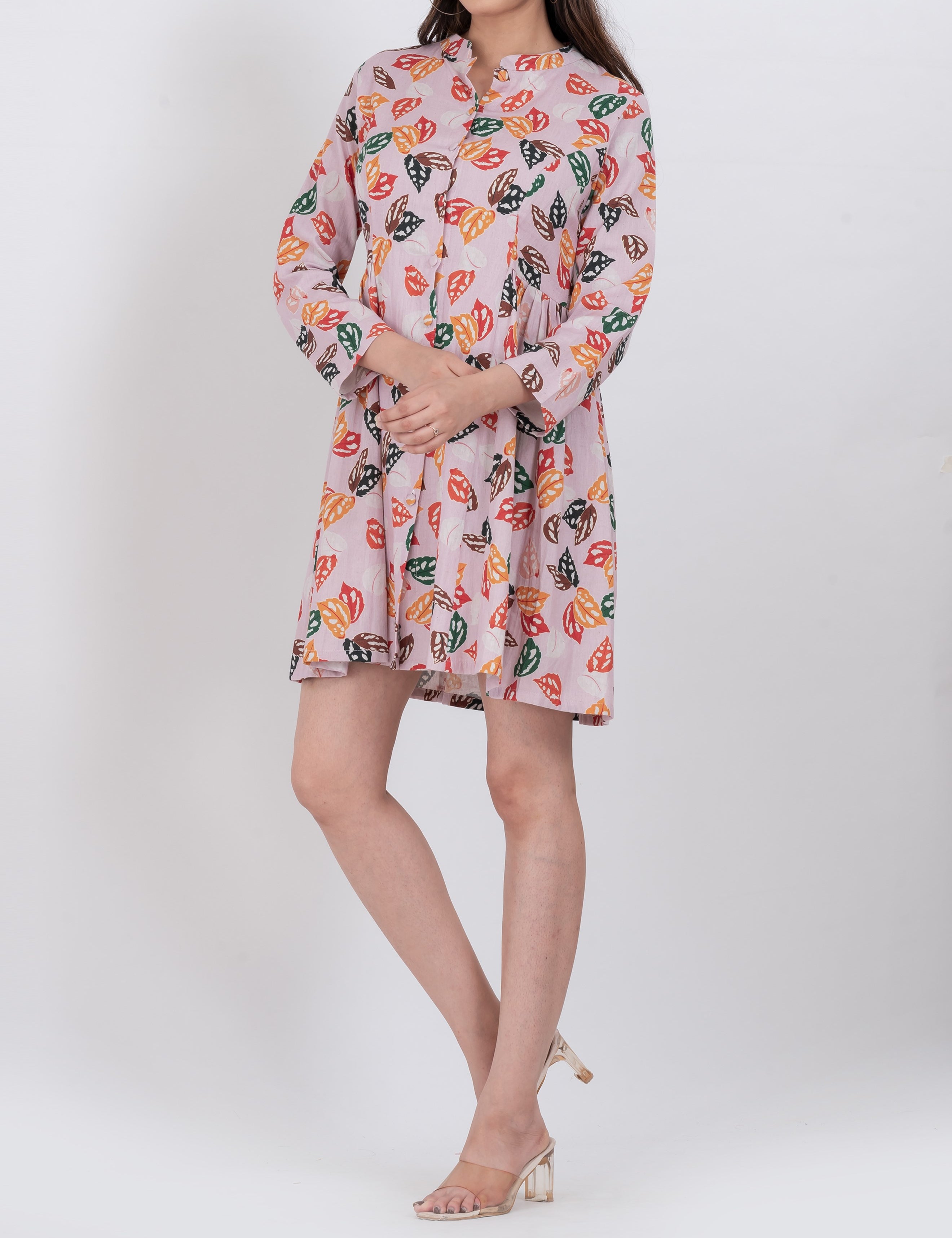  Handloom cotton A-line mini dress with multicolor leaf print and button front.