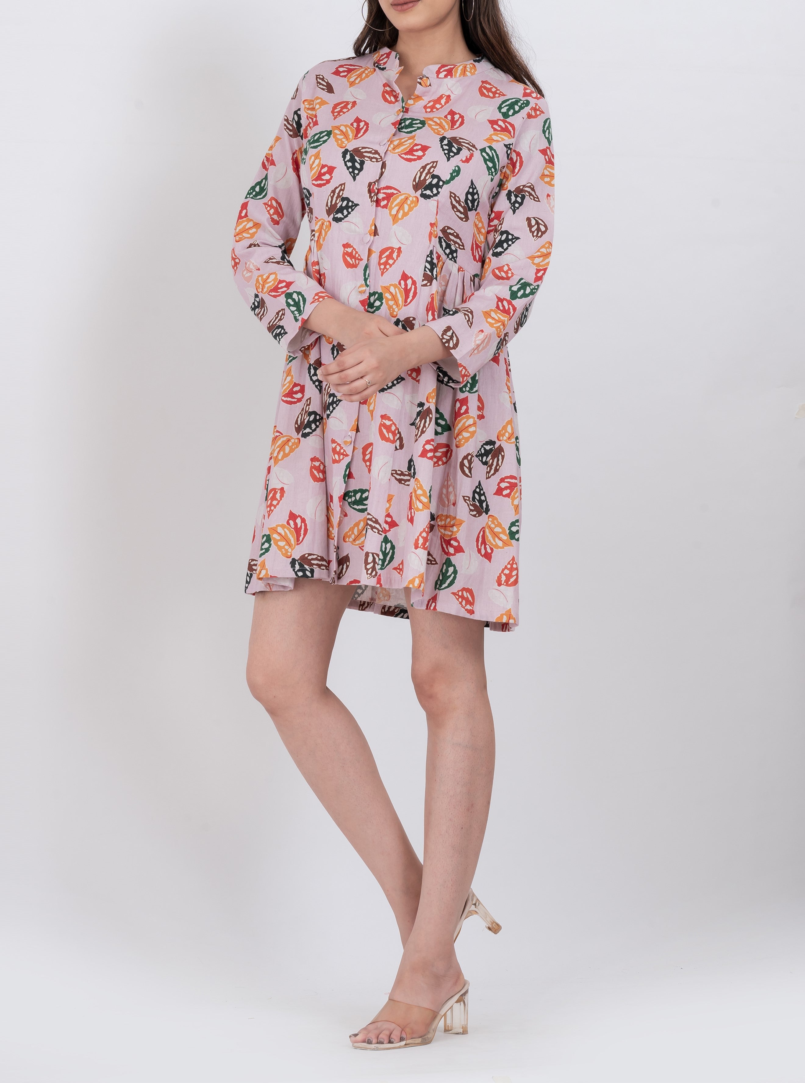  Handloom cotton A-line mini dress with multicolor leaf print and button front.