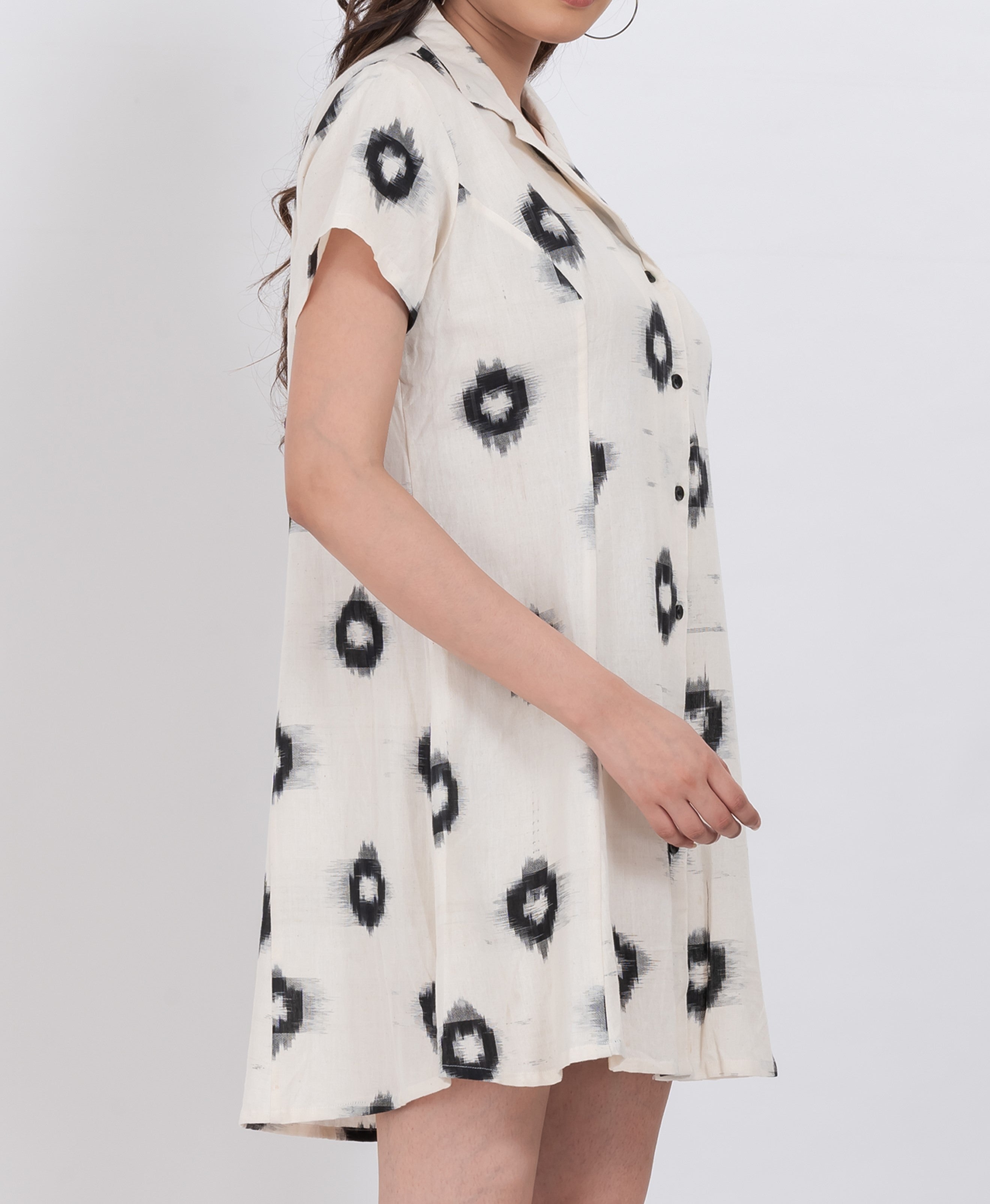 a short sleeve mini dress in breathable cotton featuring an ikat-inspired abstract pattern and button front